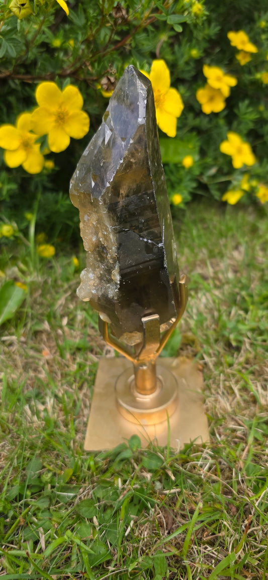 Large lightening struck smokey quartz dt on a spinning stand